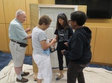 Four people standing face to face