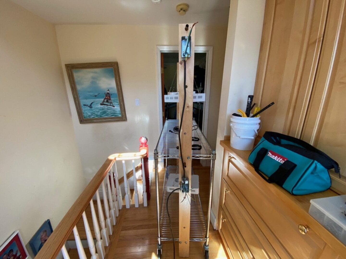 A ladder on a stairway with a tool on it.