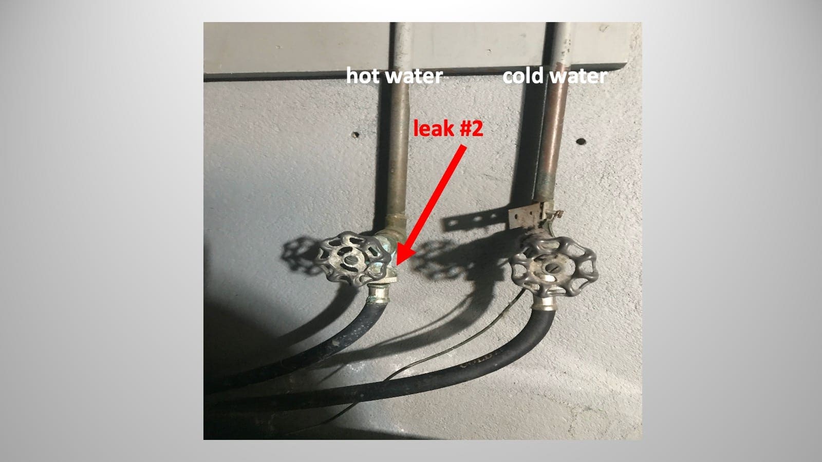 A picture of a water hose with a red arrow pointing to it.